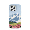 Coque pour iPhone 15 Pro : montagnes et fleurs bleu poudre